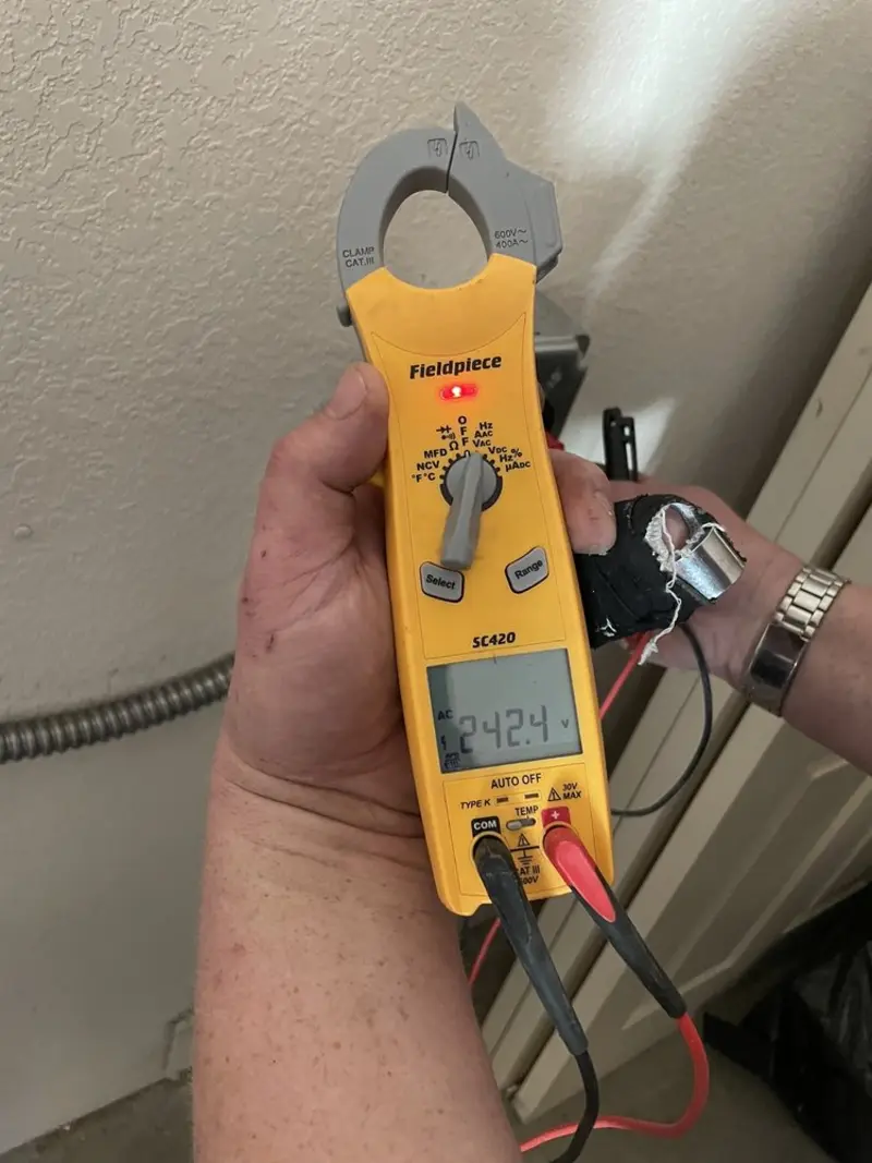 Voltage testing with clamp meter during Hot Tub / Pool Electrical Wiring in Lake